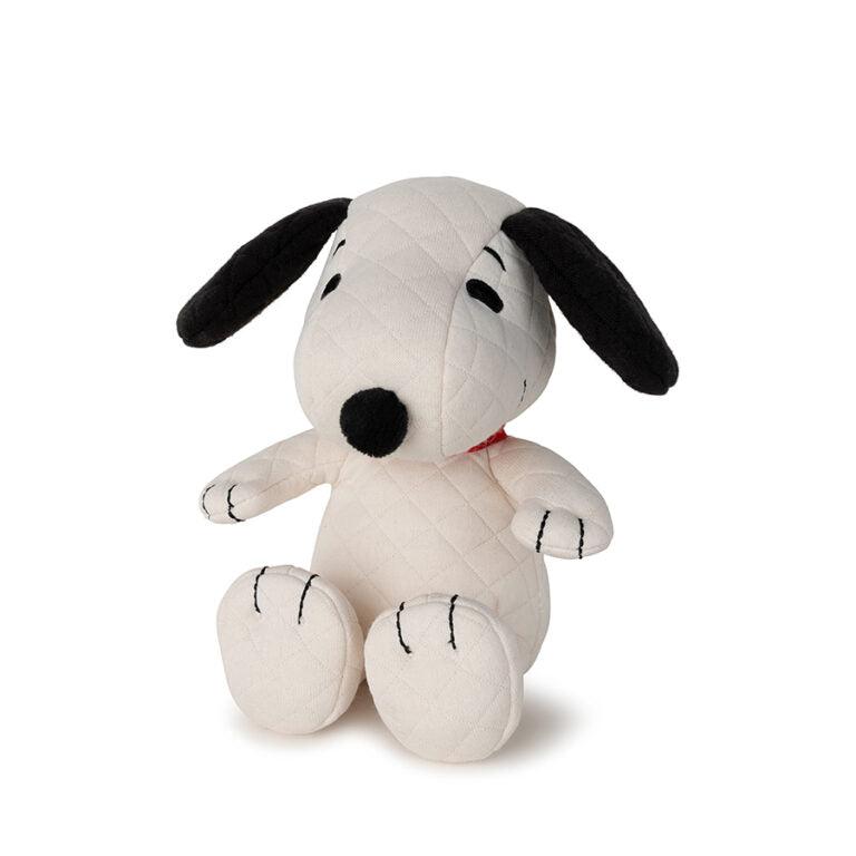 Stuffed Snoopy dog with quilted texture, black ears and nose, sitting pose.