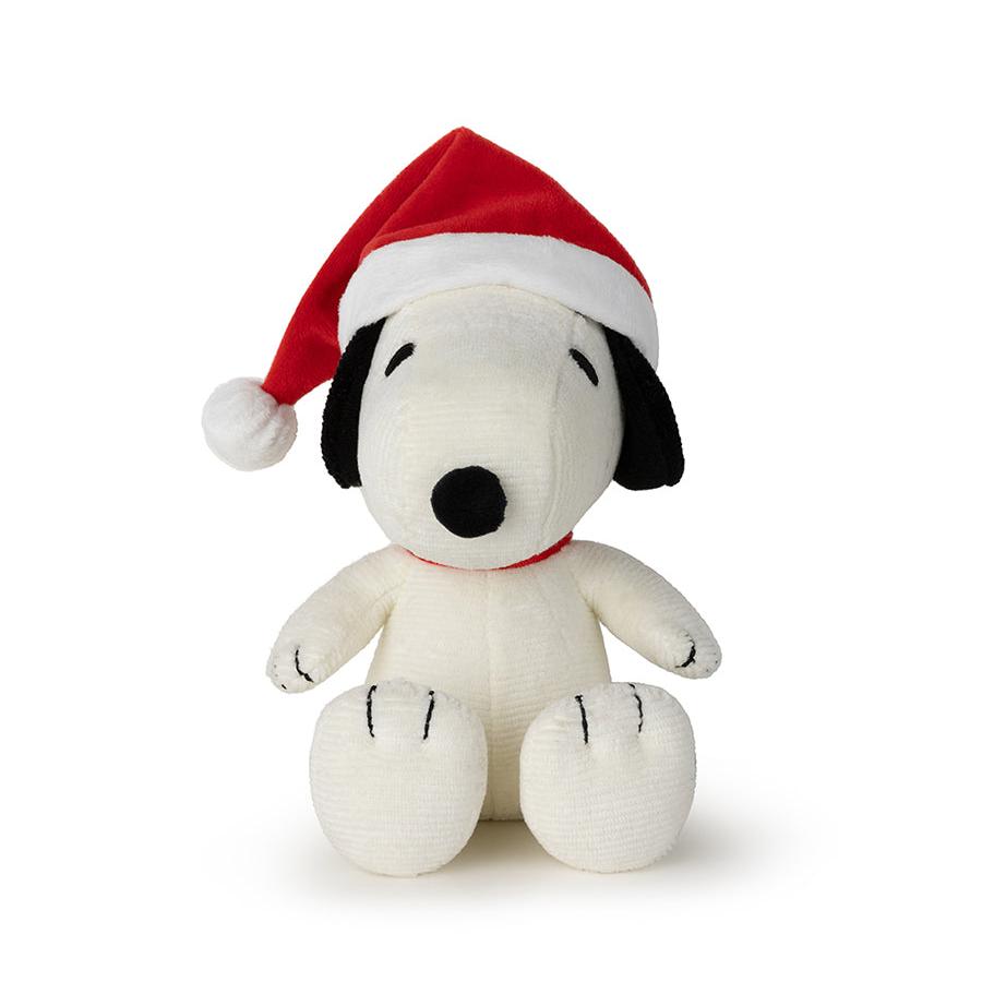 Snoopy plush toy wearing a red Santa hat.