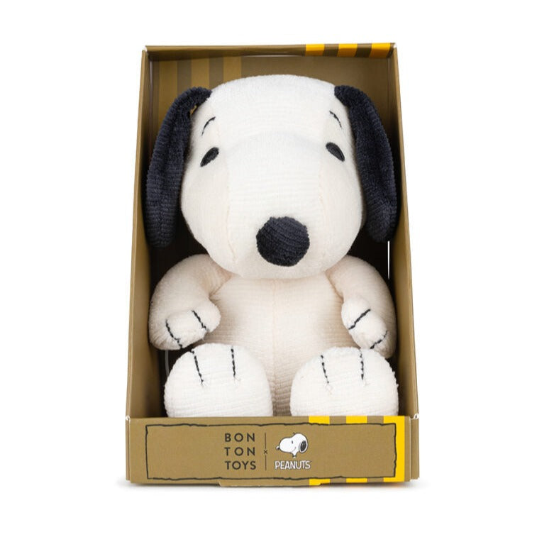 Stuffed Snoopy toy in box.