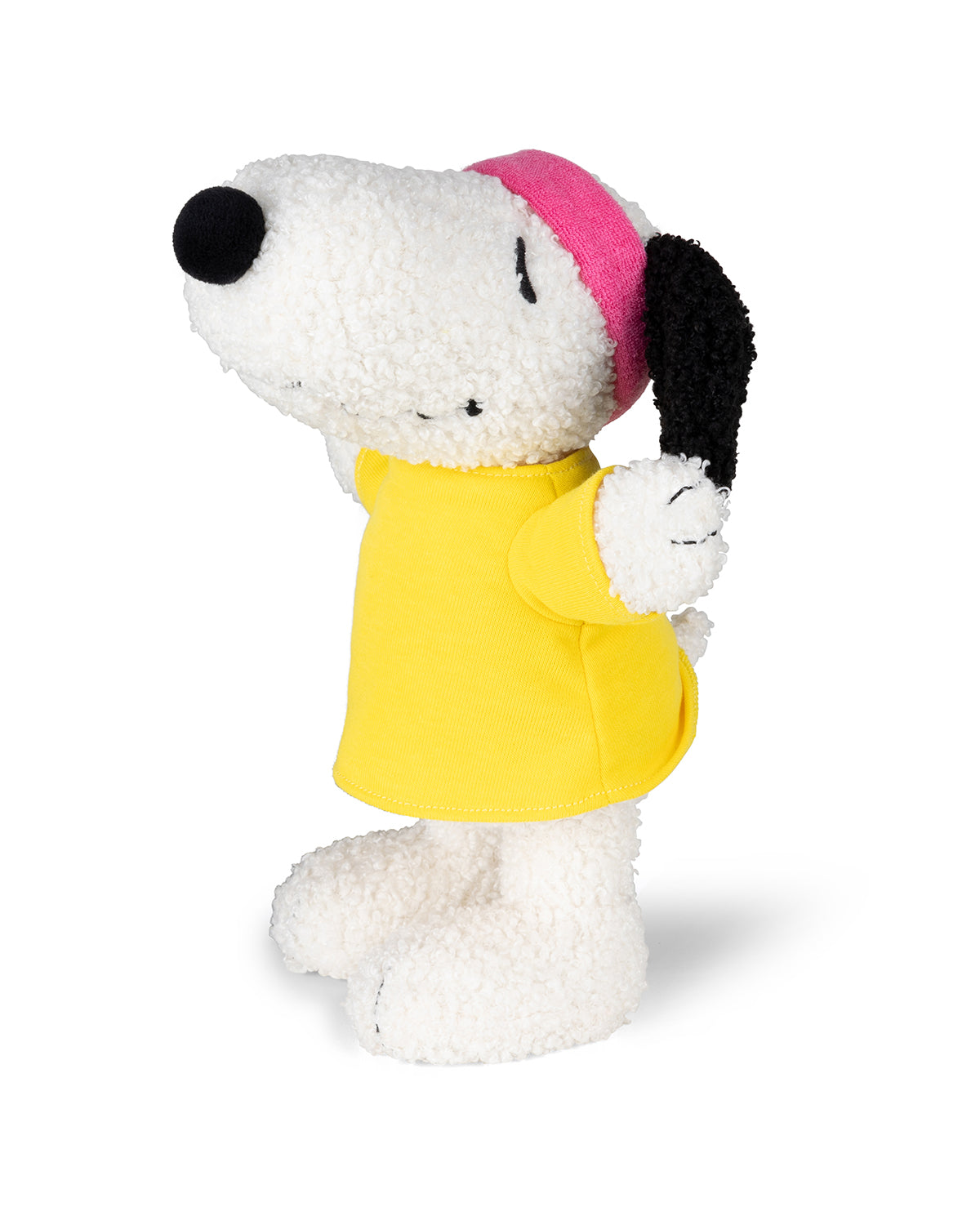 Snoopy plush toy in yellow shirt and pink headband.