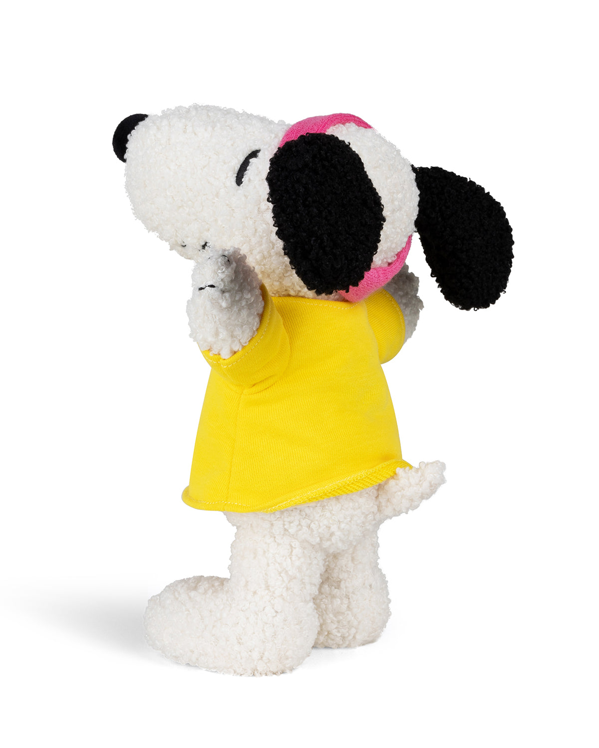 Stuffed Snoopy dog in yellow t-shirt.
