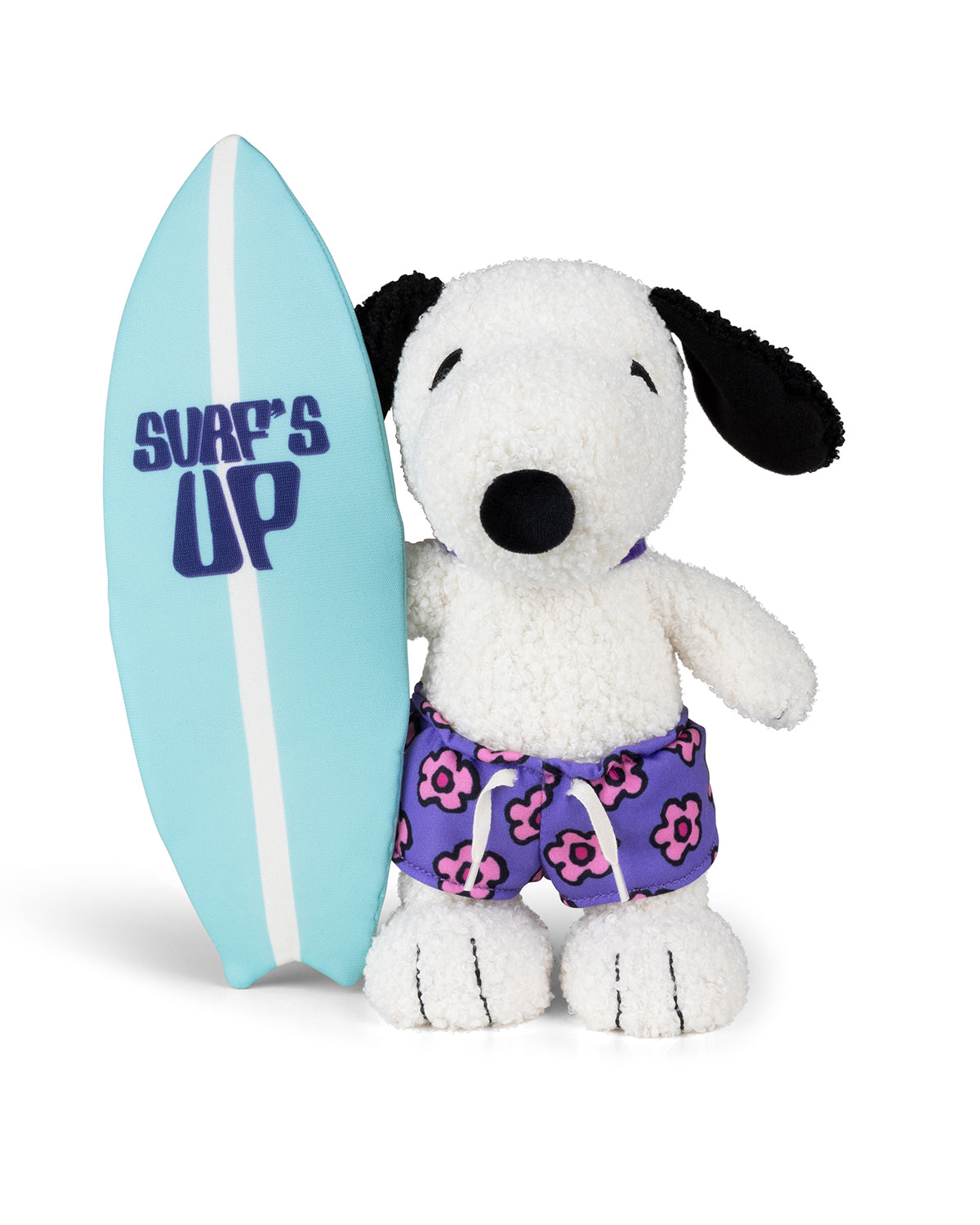 Stuffed Snoopy dog holding a surfboard and wearing flower-print swim trunks.