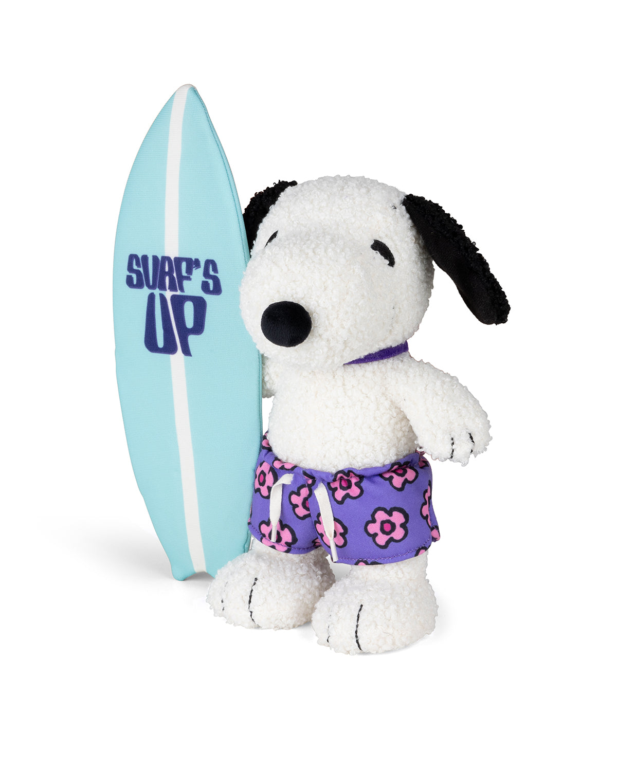 Stuffed Snoopy in floral swim trunks with a surfboard.