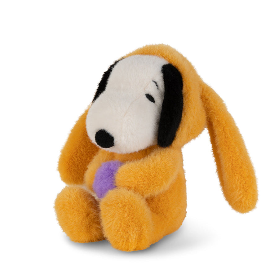 Plush dog toy with a purple heart on a white background
