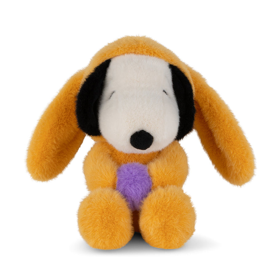 Plush toy resembling a dog with a purple heart on a white background