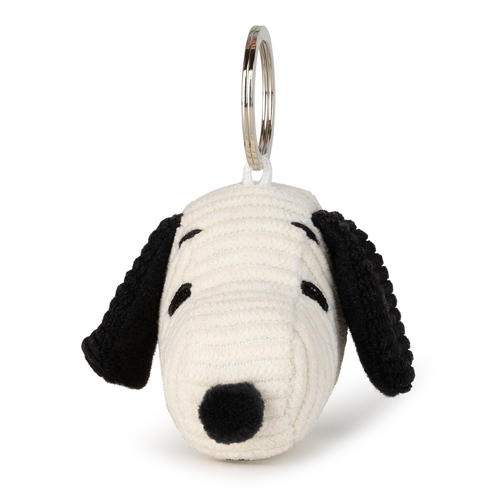 Stuffed Snoopy head keychain with white body, black ears and nose, and a silver metal ring.