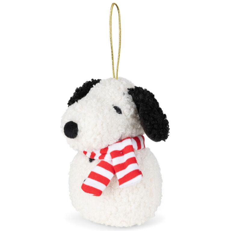 White and black plush Snoopy Christmas ornament with red and white striped scarf.