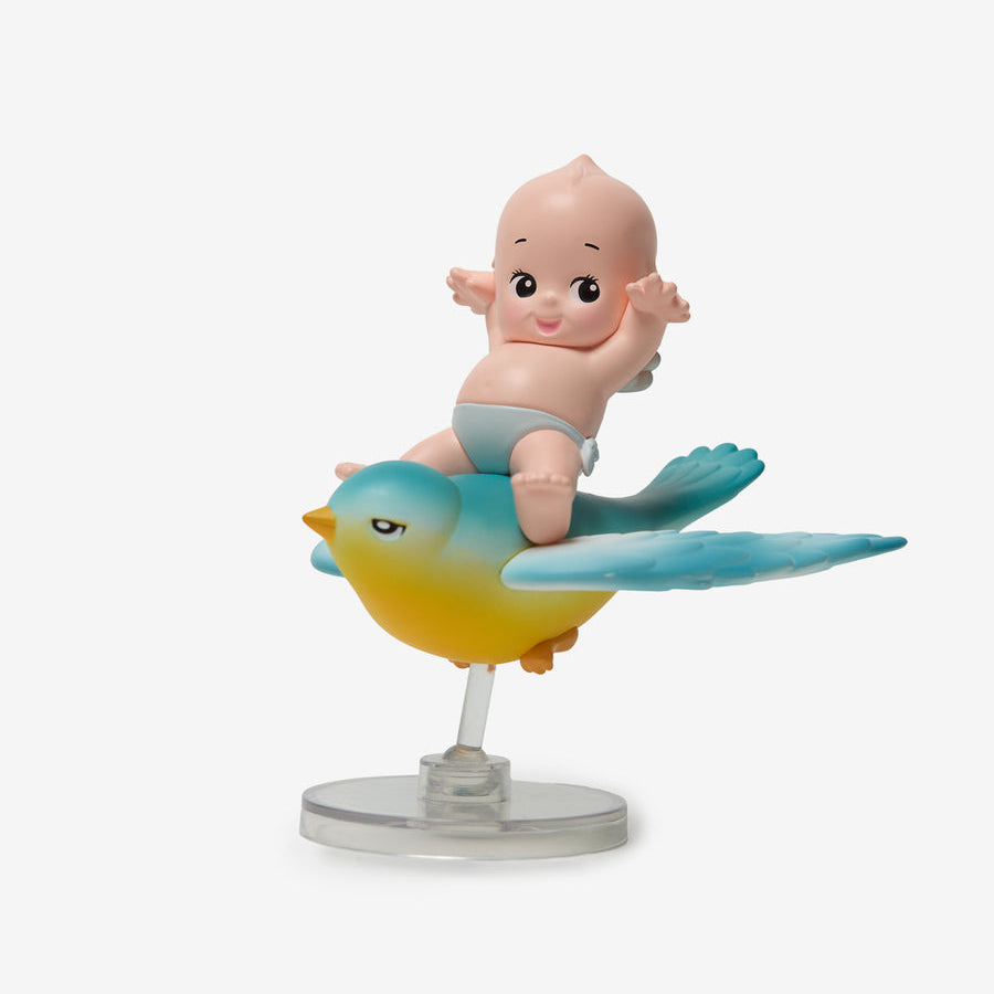 Figurine of a baby on a bird with a white background