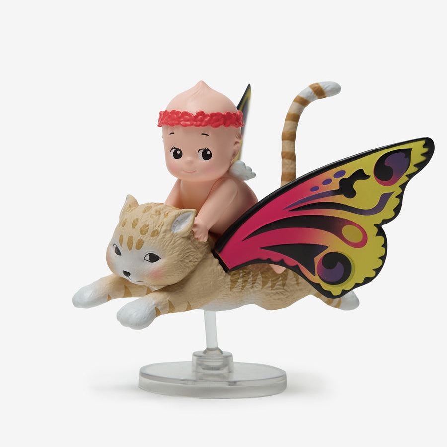 Figurine of a baby with butterfly wings and a cat-like creature on a white background