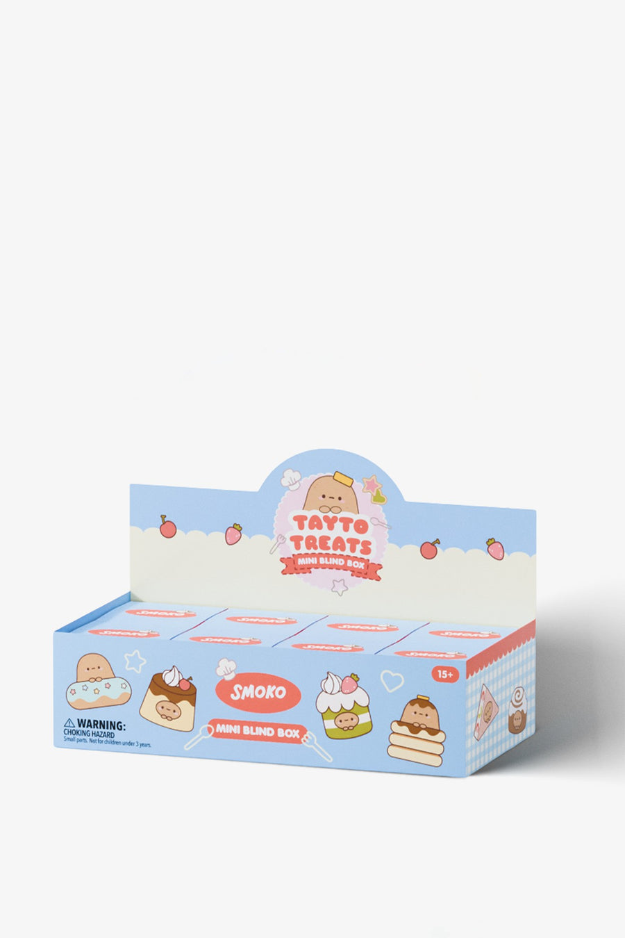 A retail display box of Smoko Tayto Treats mini blind boxes, featuring a light blue and white design with cute cartoon treats and strawberries.
