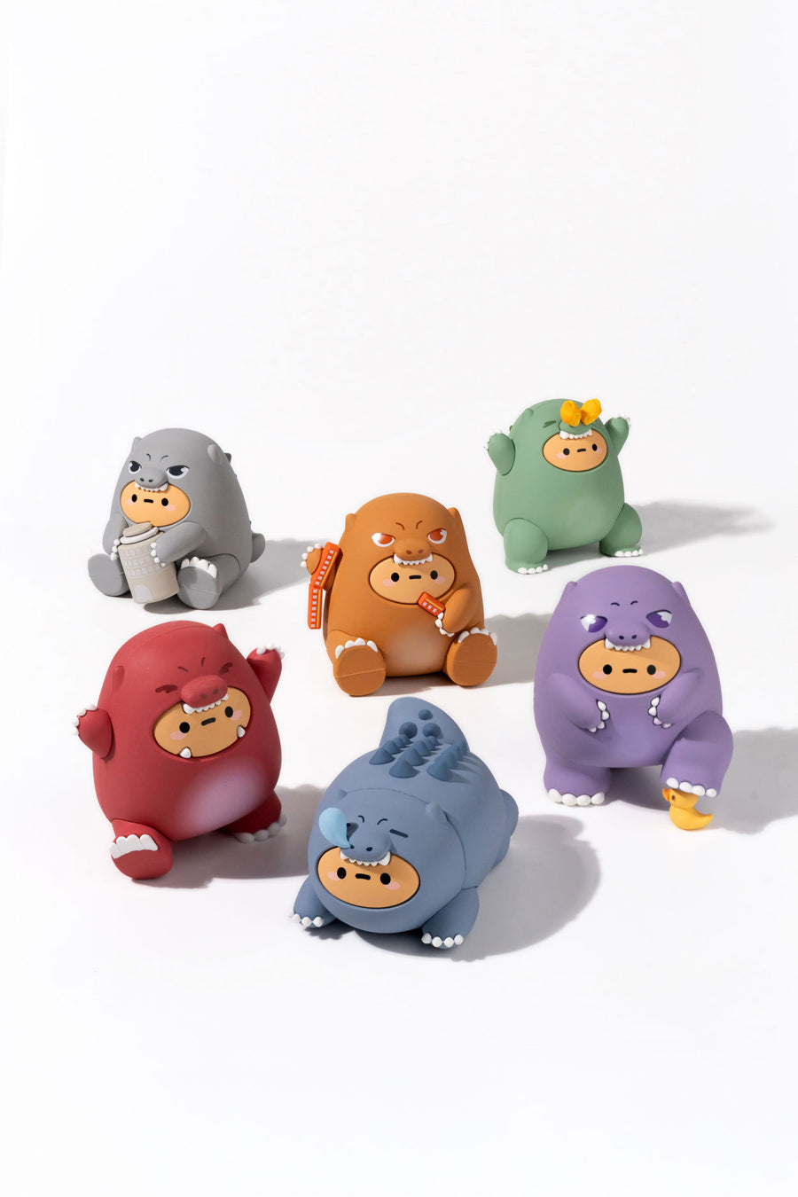 Set of colorful cartoon-like figurines on a white background