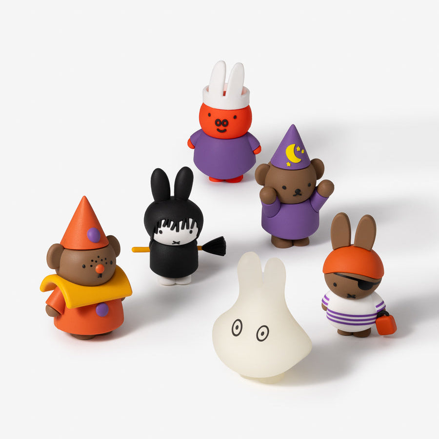 Set of colorful toy figures on a white background