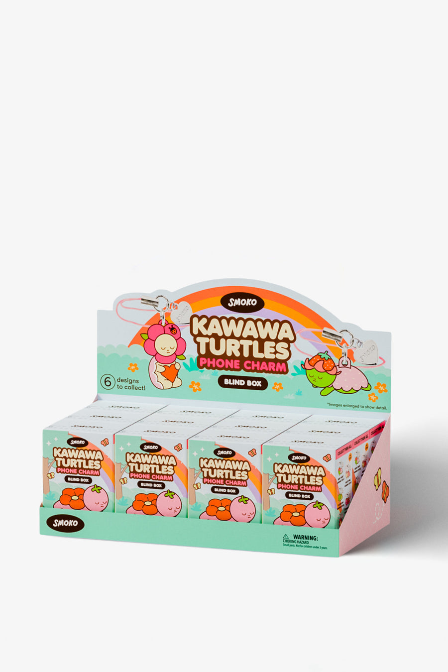 A retail display box filled with small 'Kawawa Turtles Phone Charm' blind box packs by Zoro, featuring colorful cartoon turtle graphics on a light gray background.