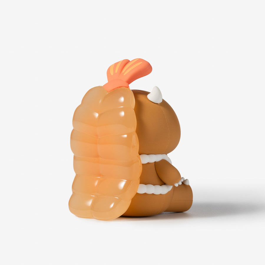 A small orange and brown cartoon figurine shown from the back on a clean white background.