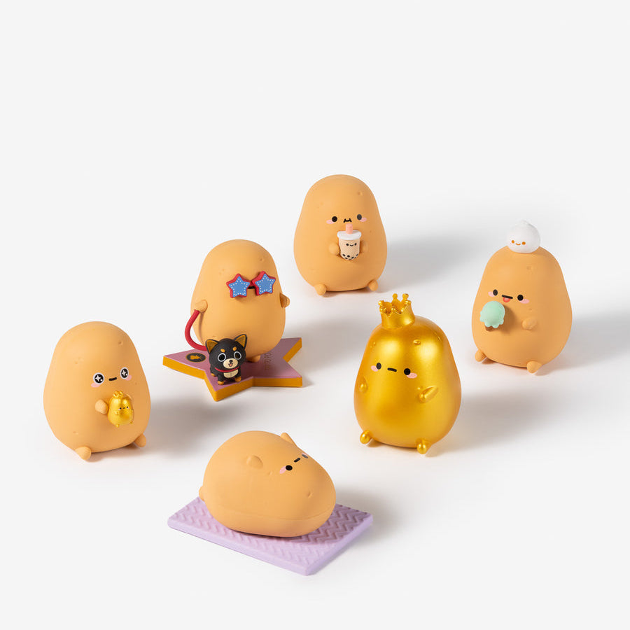 Six cute, egg-shaped collectible figurines in various poses and colors, including yellow, gold, and orange, arranged on a clean white background.