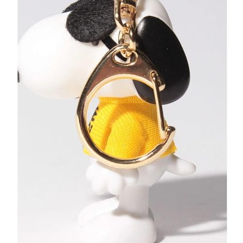 Snoopy keychain with yellow fabric and gold metal clasp.