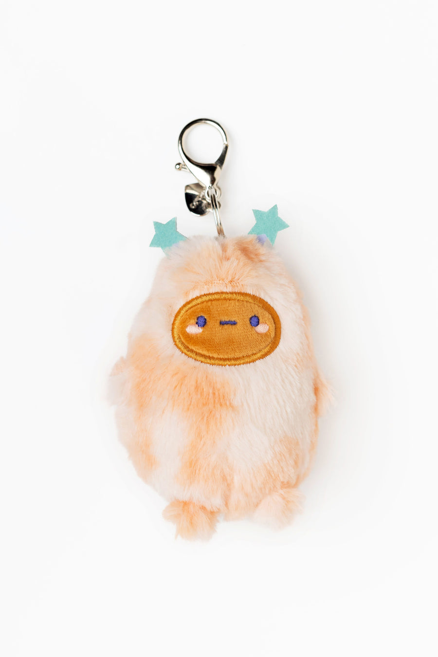 Plush keychain with a cute face design on a white background