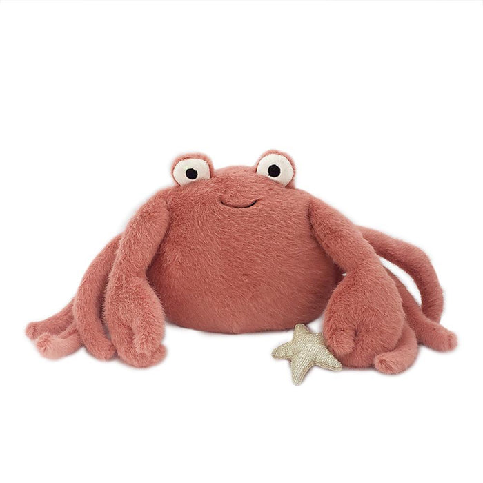 Stuffed reddish-brown crab toy with a small starfish.