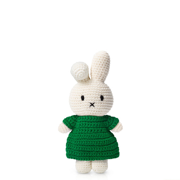 Crocheted Miffy bunny wearing a green dress.