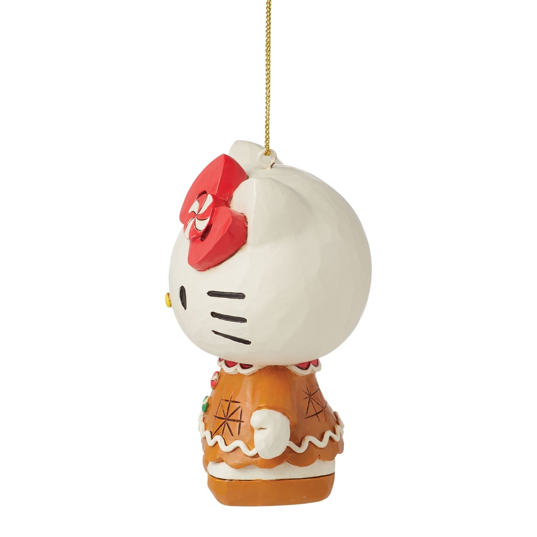 Hello Kitty gingerbread ornament hanging on a gold chain.