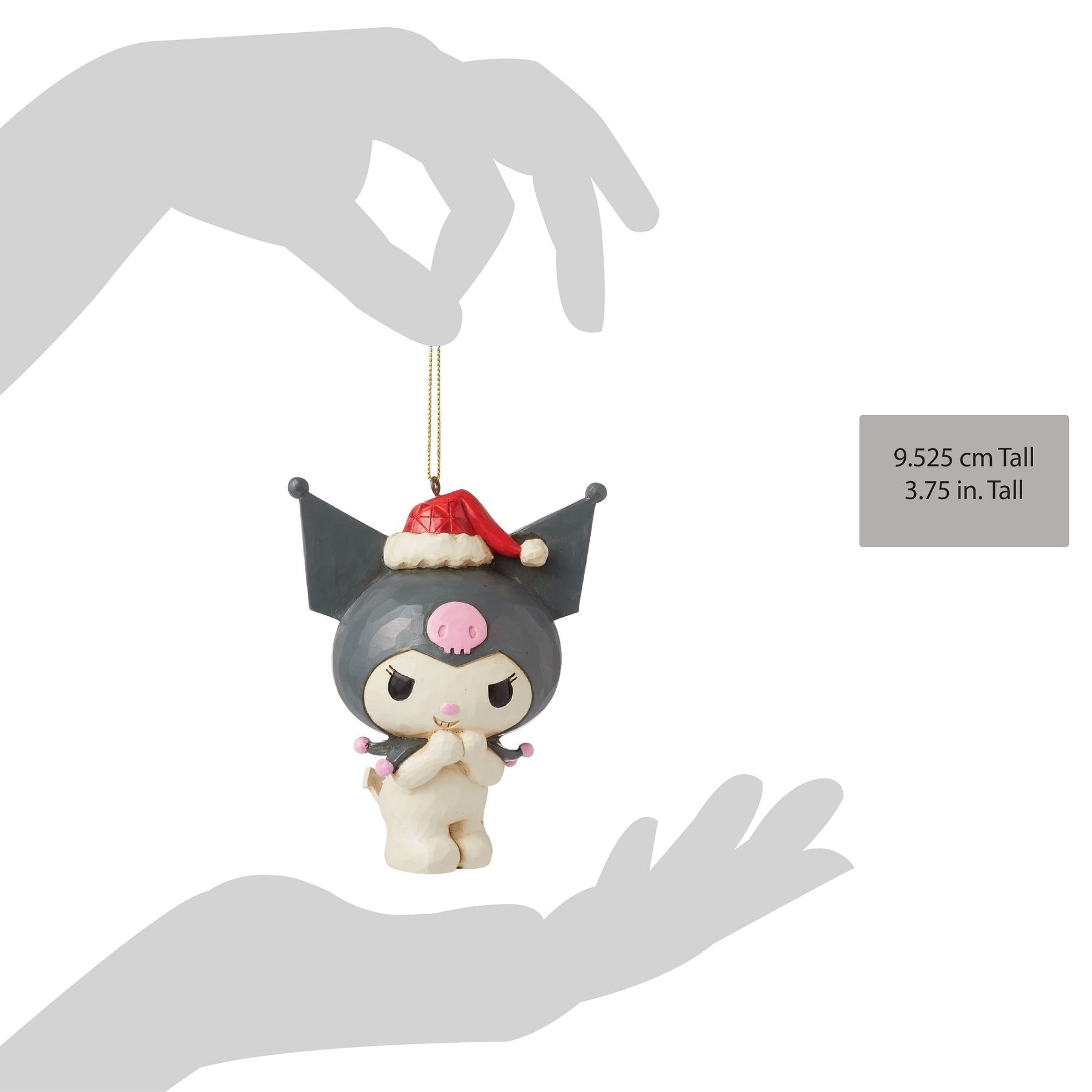 Gray figurine of Kuromi with a red Santa hat held in a hand.