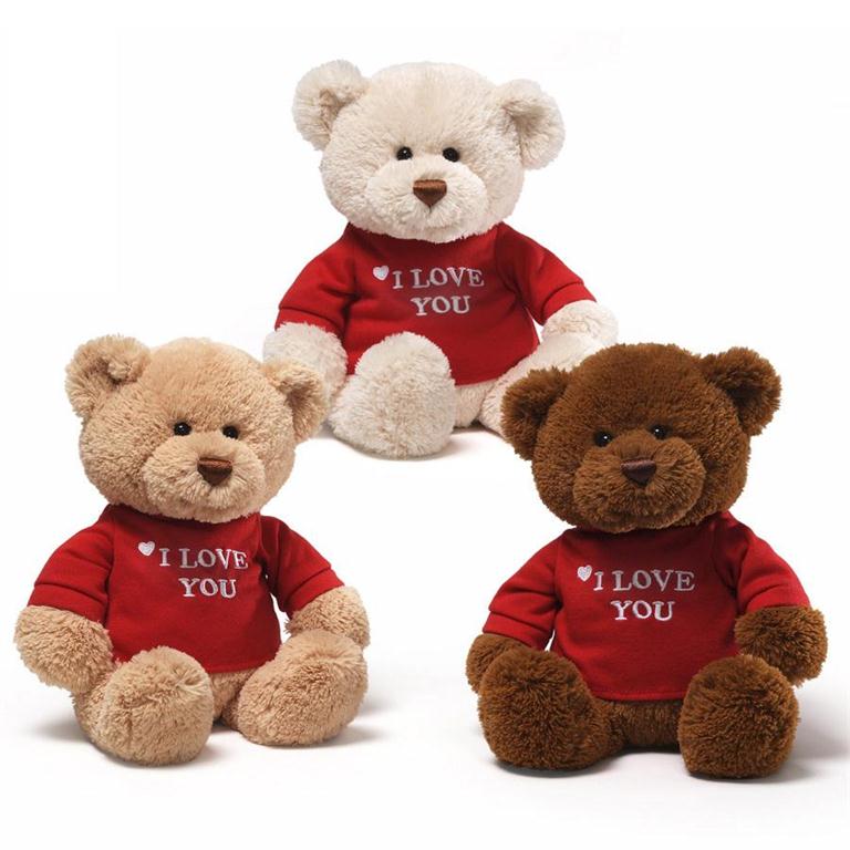 Three teddy bears wearing red "I Love You" shirts.