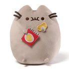 Pusheen plush toy holding a chip bag and chip.