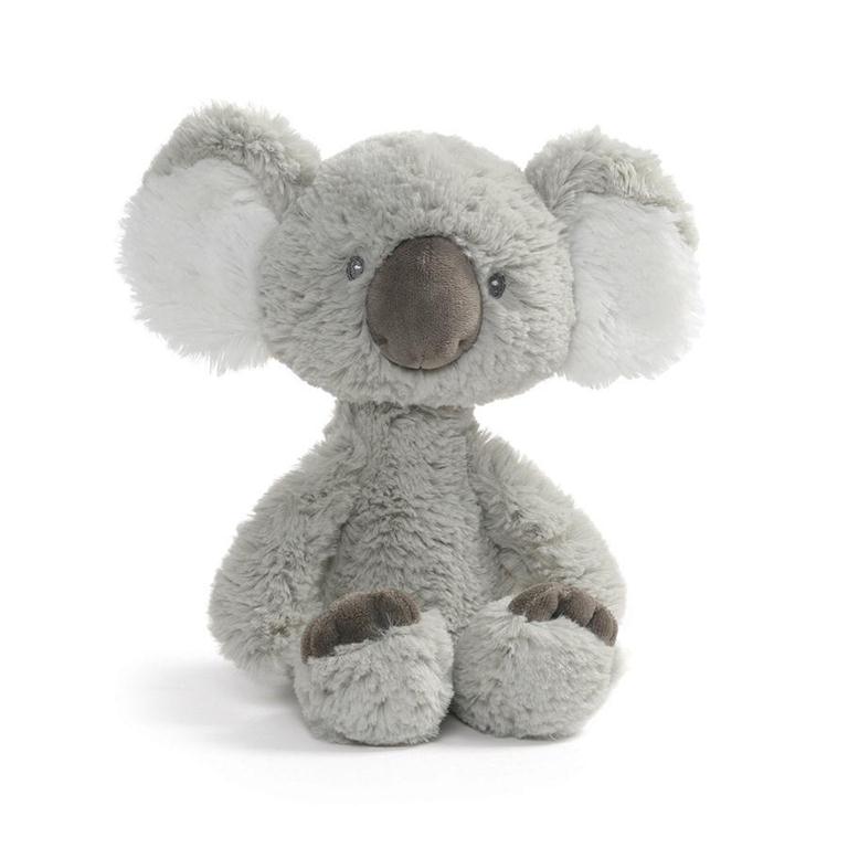 Grey plush koala toy sitting.