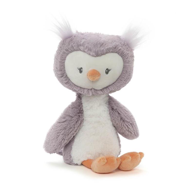 Purple owl plush toy with white accents and orange feet.