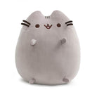 Gray Pusheen cat plush with whiskers and outstretched paws.