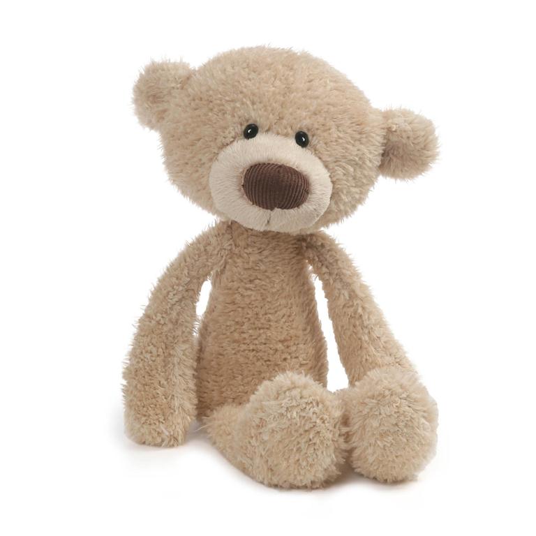 Tan teddy bear with corduroy nose, sitting.