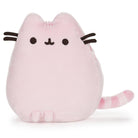 Pink plush Pusheen cat with whiskers and striped tail.