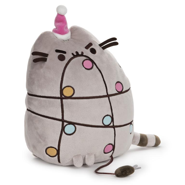 Gray Pusheen plush toy wearing a pink Christmas hat and decorated with lights.