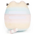 Pastel rainbow Pusheen plush with white stripes and a tail.