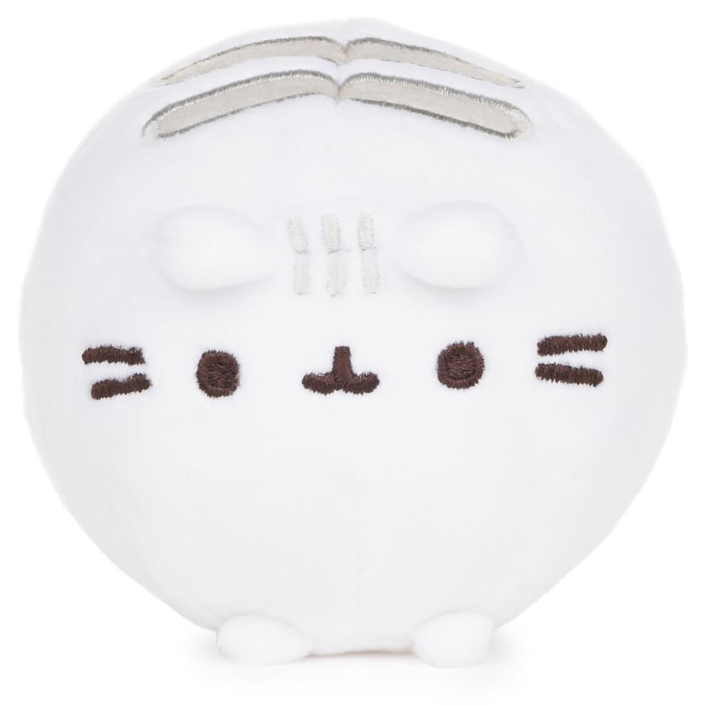 White round plush toy with a simple face design on a white background