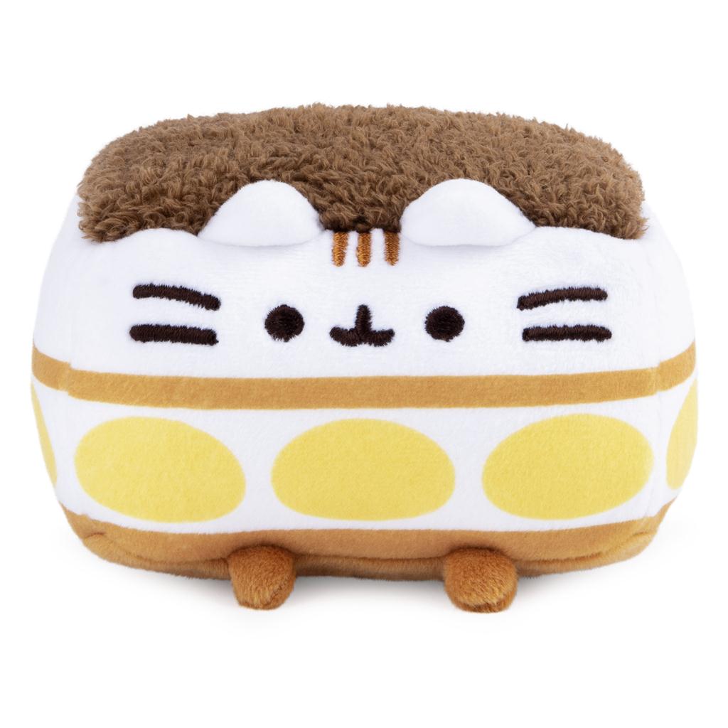 Pusheen cat plush toy with brown fur, white body, yellow polka dots, and embroidered face.
