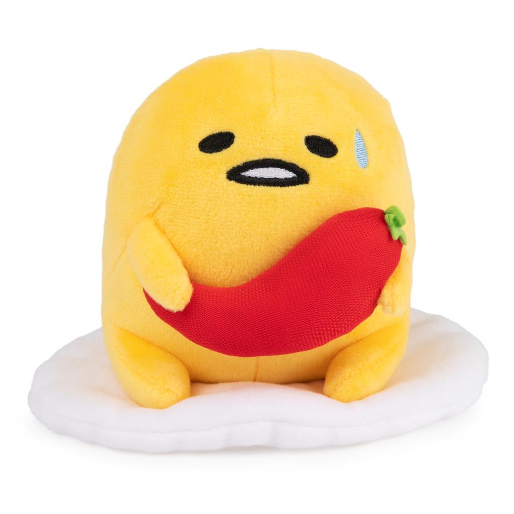 Gudetama plush holding red chili pepper.
