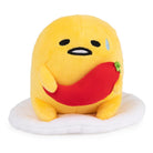Gudetama plush holding red chili pepper.