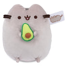 Pusheen plush toy holding an avocado.