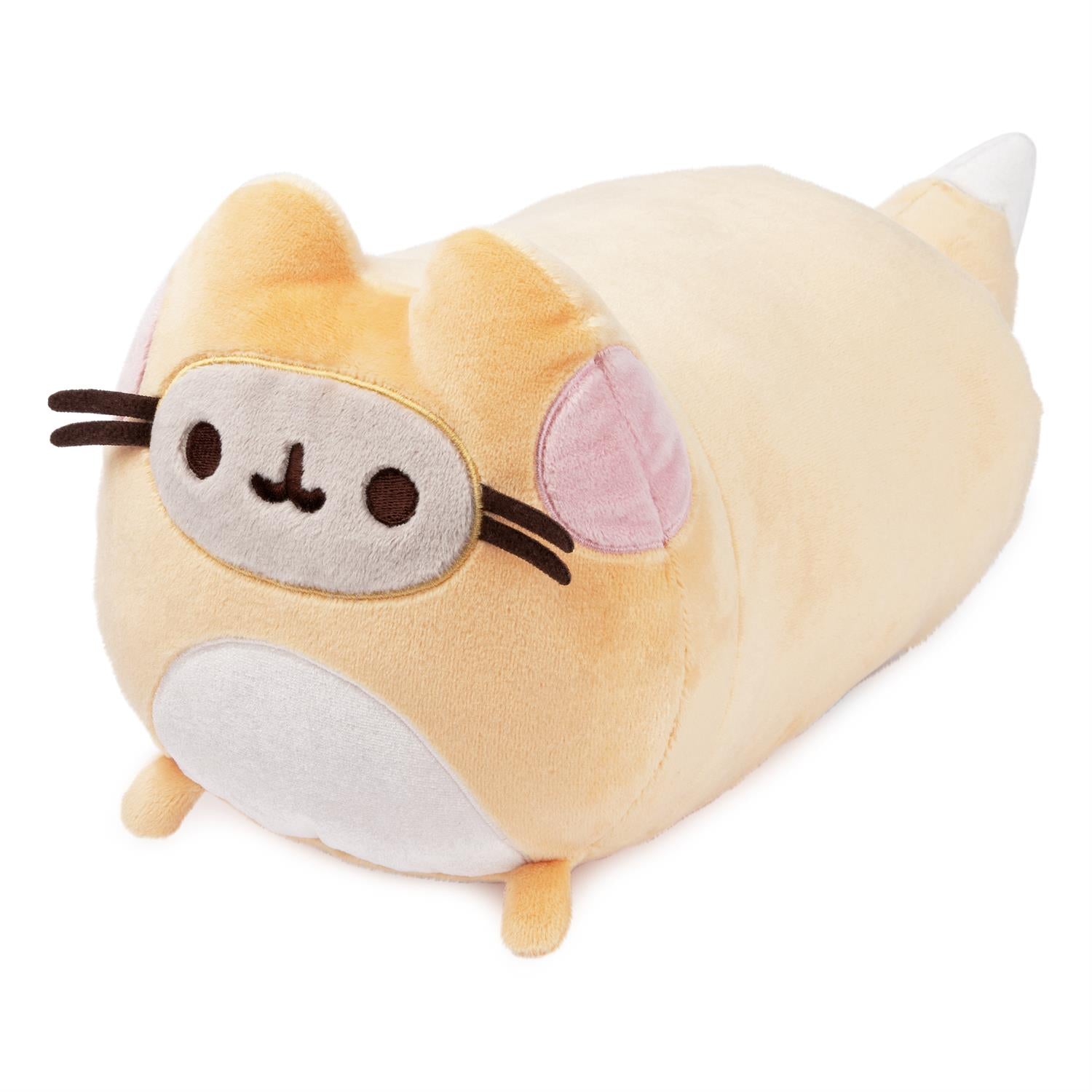 A plush beige cat wearing a sleep mask.