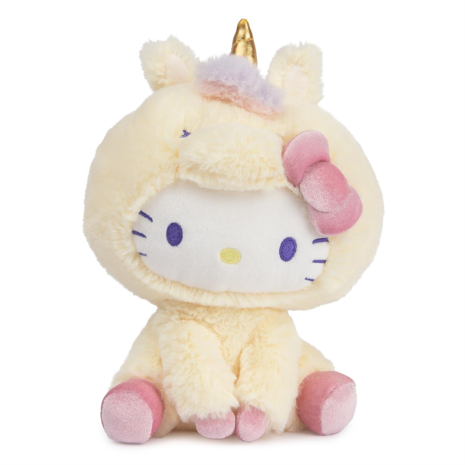 Stuffed Hello Kitty plush toy dressed as a unicorn with a golden horn and pink bow.