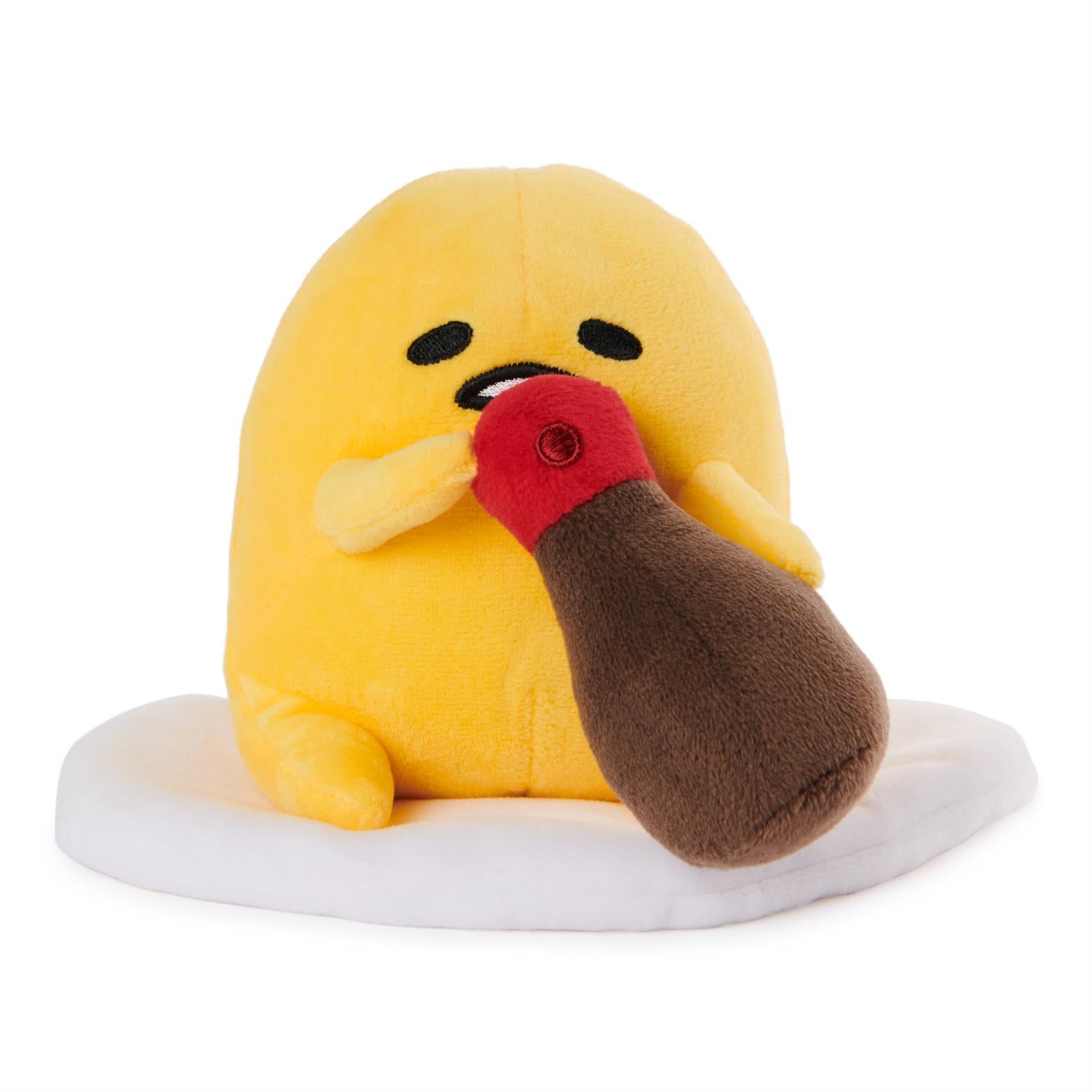 Plush yellow egg character with soy sauce bottle.