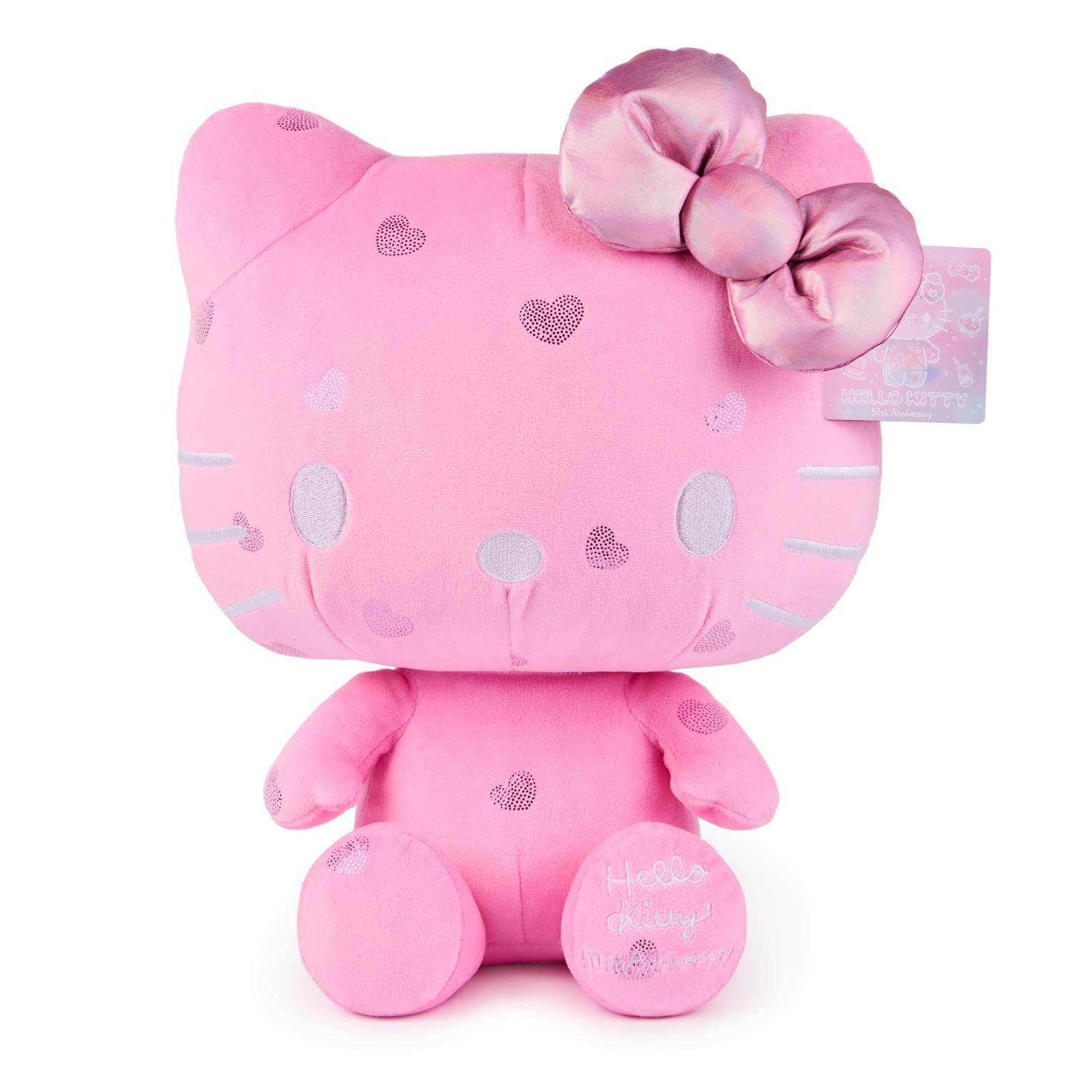Pink plush Hello Kitty doll with a shiny bow and heart patterns.