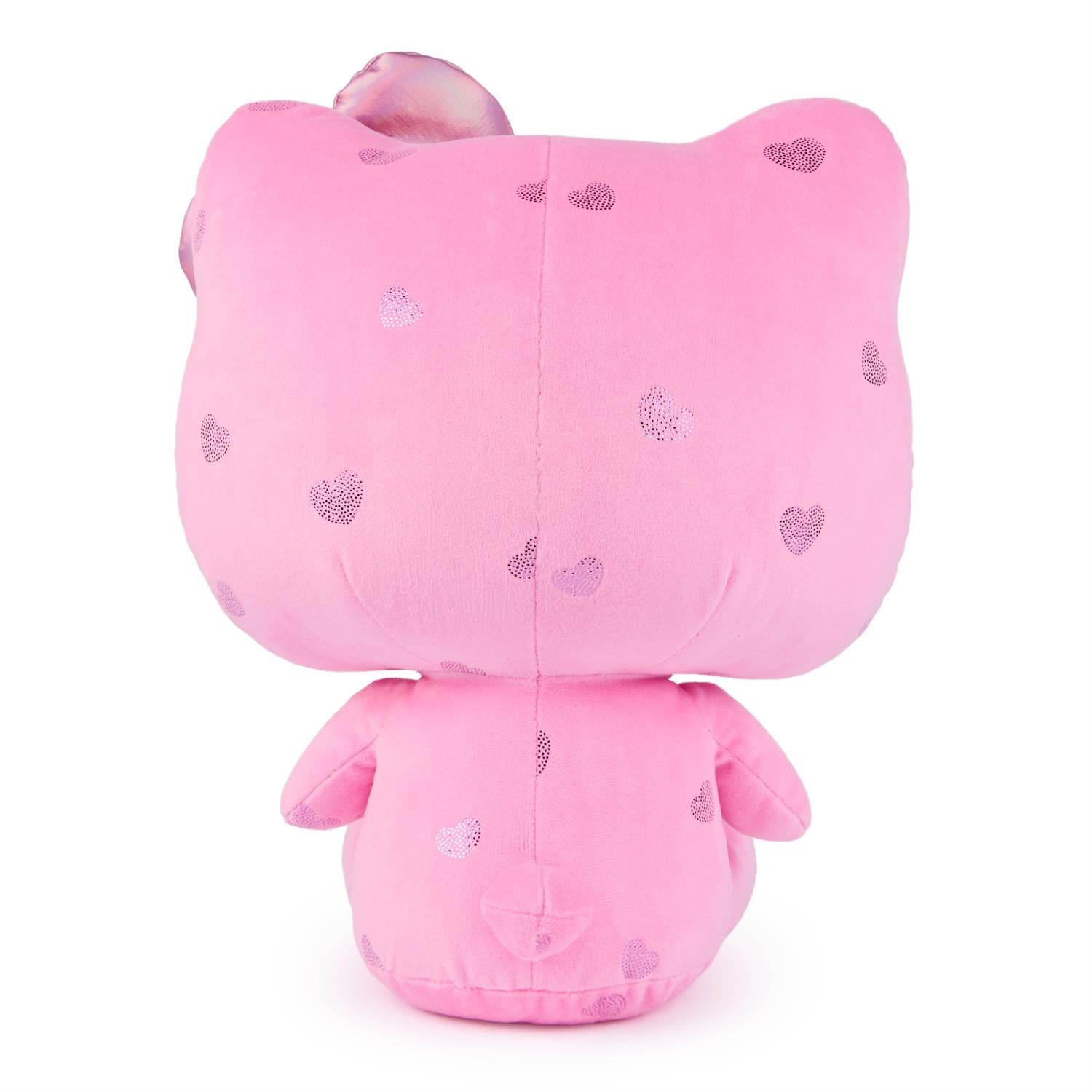Back of a pink Hello Kitty plush toy with heart patterns.