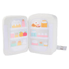 White, plush toy refrigerator with colorful toy food displayed in see-through doors.