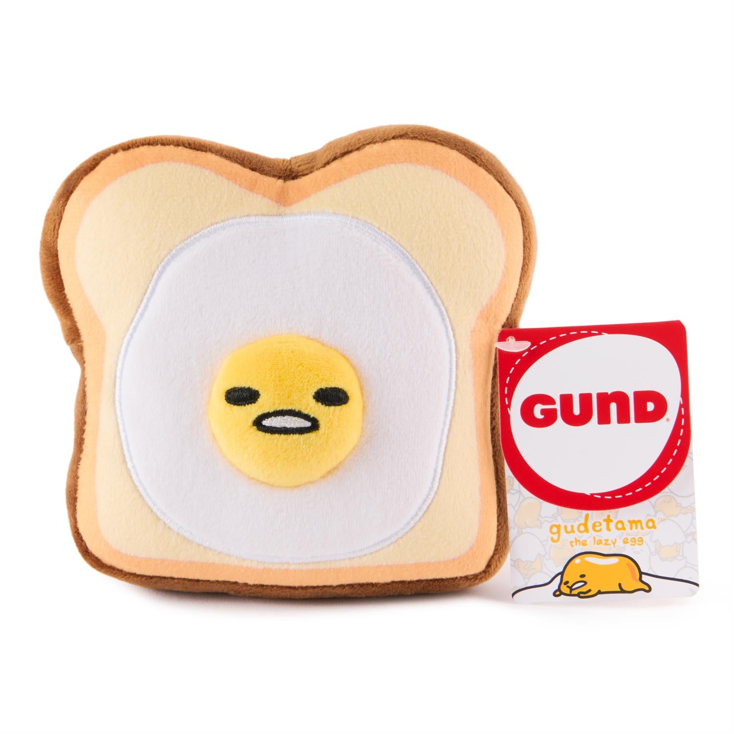 Plush toy of Gudetama on toast with a GUND tag.