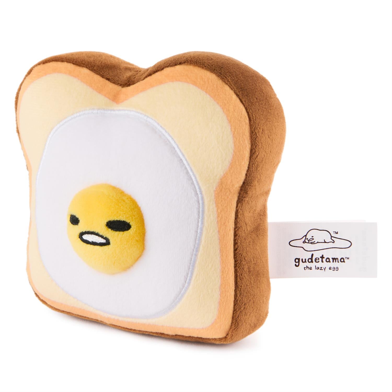 Stuffed plush toy of toast with an egg on it.