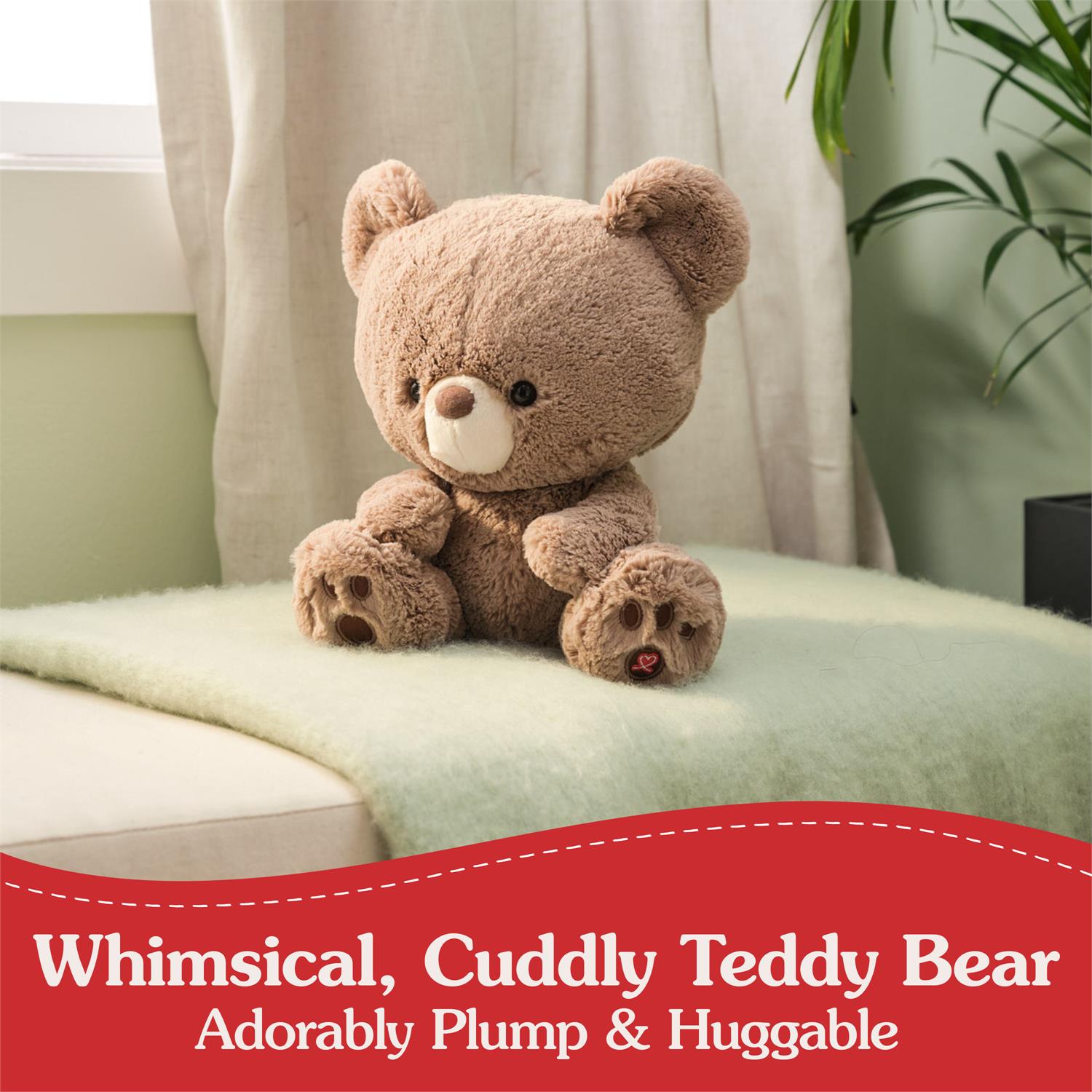 Brown plush teddy bear with a white muzzle and paw pads sitting on a green blanket.