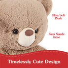 Close-up of a brown plush teddy bear with a faux suede nose.