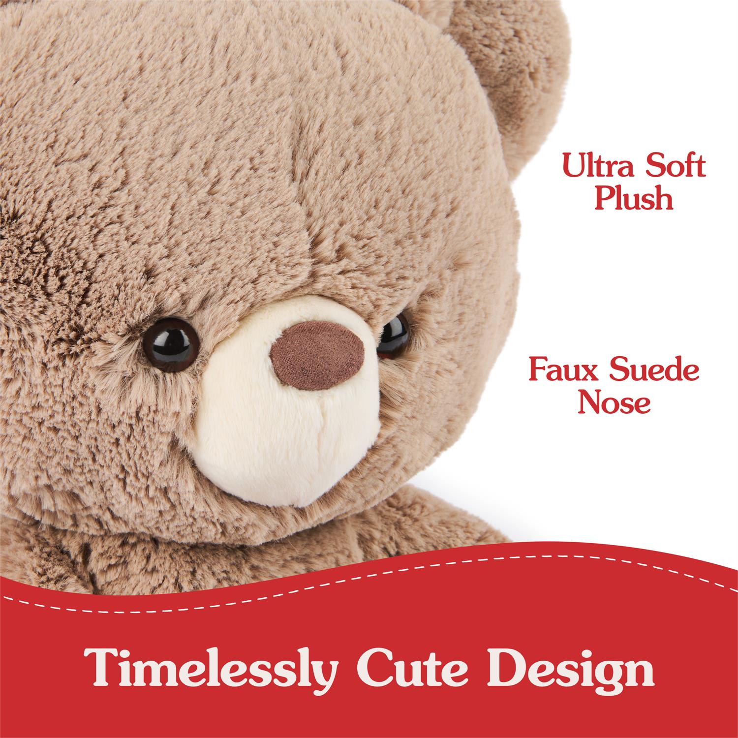 Close-up of a brown plush teddy bear with a faux suede nose.